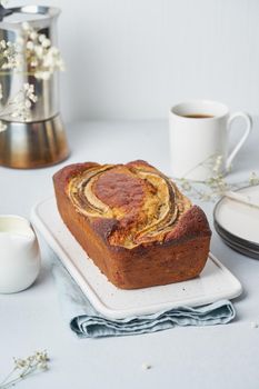 Whole Banana bread. Cake with banana. Traditional american cuisine. Side view, vertical