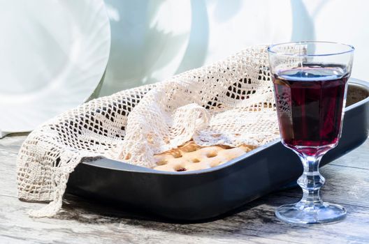 Homemade cherry pie with a knitted cloth and glass of wine. From the series "Homemade Cherry Pie"