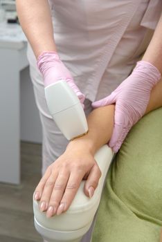 Laser hair removal procedure on ladies hand