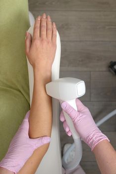 Laser hair removal procedure on ladies hand