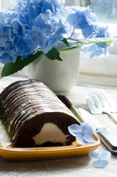 Chocolate cake with mint and blueberries on rectangular plate. the series "Chocolate cake"