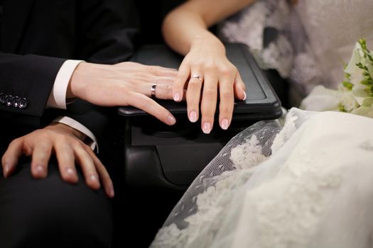 Hands with wedding rings