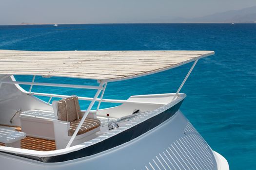 Boat bow sailing in blue Mediterranean sea in summer vacation