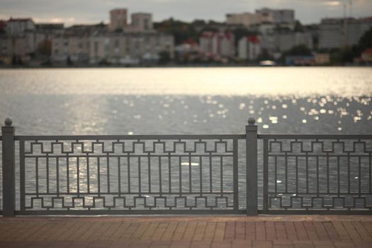 fence in the background of the lake.