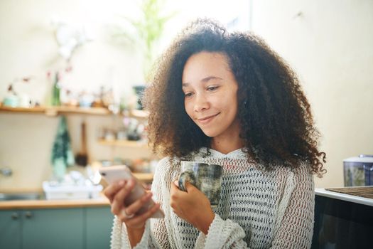 Beautiful girl enjoying coffee and social media