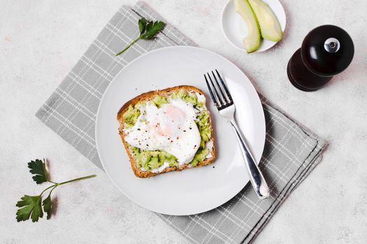 egg with avocado toast plate