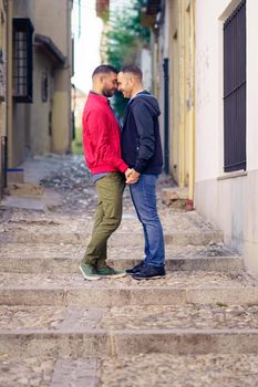 Gay couple in a romantic moment in the street. Lifestyle concept.