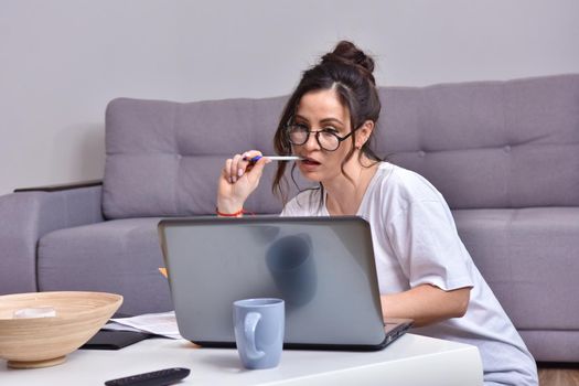 Working from home. beautiful young woman working using laptop while sitting in home office