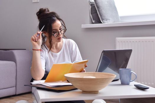 Working from home. beautiful young woman working using laptop while sitting in home office