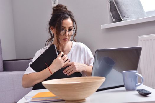 Working from home. beautiful young woman working using laptop while sitting in home office