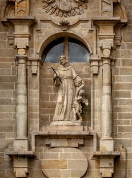 Religious statue on a house in Santiago de Compostela, Spain