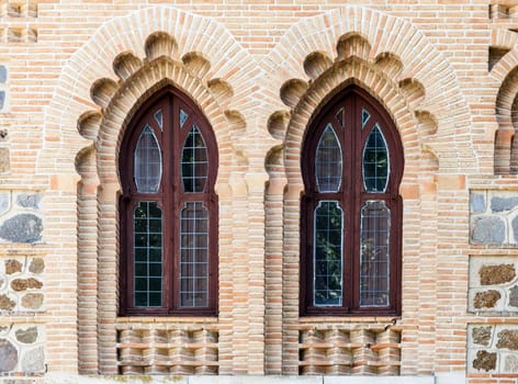 Ornate windows in moorish style in Toledo railway station, Spain