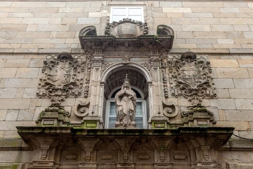 Religious statue on a house in Santiago de Compostela, Spain