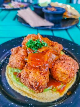 Plate of Fishballs tortillas and greens food and drink in the restaurant PapaCharly Papa Charly in Playa del Carmen Quintana Roo Mexico.