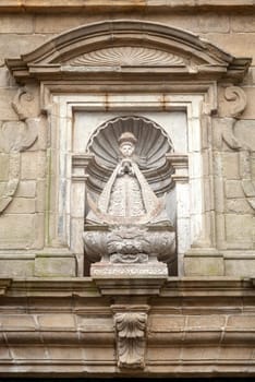 Religious statue on a house in Santiago de Compostela, Spain