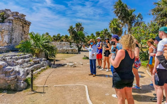 Playa del Carmen Mexico 25. March 2022 Ancient Tulum ruins Mayan site with temple ruins pyramids and artifacts in the tropical natural jungle forest palm and seascape panorama view in Tulum Mexico.