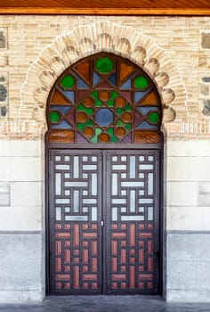 Ornate door in moorish style in Toledo railway station, Spain