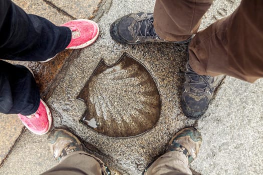 Santiago's shell on the pavement, symbol of Saint James way