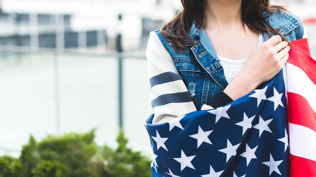 woman wrapped big american flag