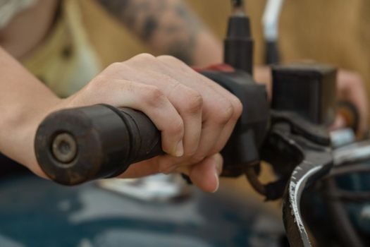 Cropped Woman Hand Riding Motorcycle