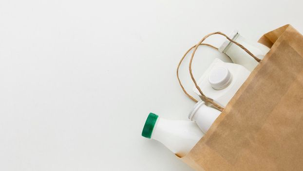 top view paper bag with milk bottles