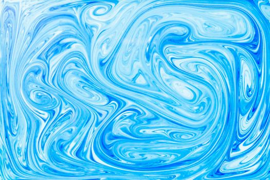 style ebru painting with blue acrylic paint swirls