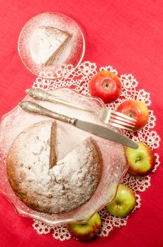 Applesauce raisin rum cake for christmas table. Table decorated with lacy napkin. From series of "Merry Christmas"