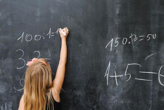 girl solving math exercise