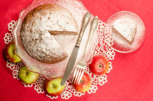 Applesauce raisin rum cake for christmas table. Table decorated with lacy napkin. From series of "Merry Christmas"