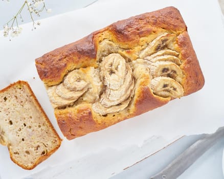 Banana bread. Cake with banana. Top view. The morning Breakfast on light grey background