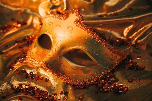 overhead view elegant gold venetian mask golden textile with sequins