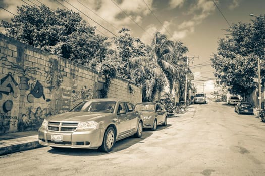 Playa del Carmen Mexico 04. February 2022 Old black and white picture of typical street road and cityscape with cars and buildings of Luis Donaldo Colosio Playa del Carmen in Mexico.