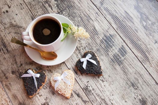 Cookies for the wedding with a cup of coffee served with a golden spoon. From the series "Wedding Cookies"