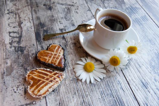 Cookies for the Valentine's Day with a cup of coffee served with a golden spoon. From the series "Valentine's Day Cookies"