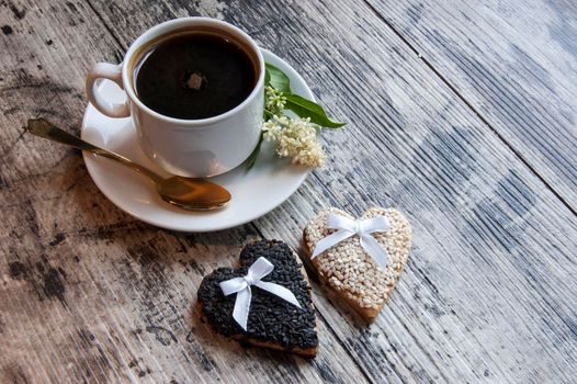 Cookies for the wedding with a cup of coffee served with a golden spoon. From the series "Wedding Cookies"