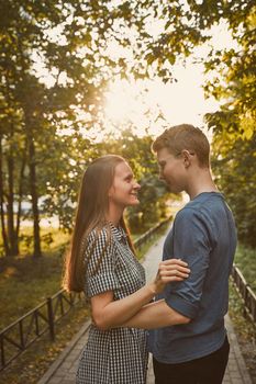 male and female person looking at each other, flirting, concept of teen love and happiness