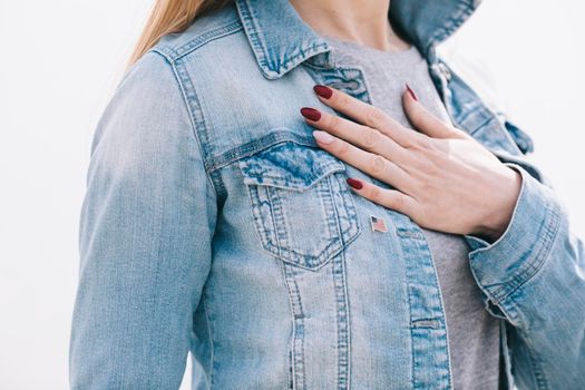 woman with left hand chest