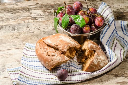 Bread and vegetables on old wooden table. From the series "Healthy Food"