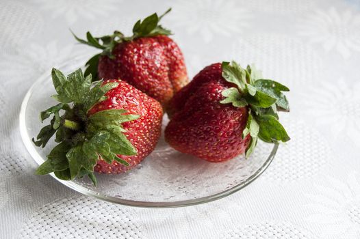 Fresh strawberry on a glass plate