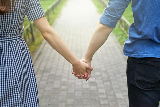 girl and boy holding hands, concept of love, teen relationships