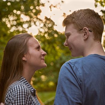 male and female person looking at each other, flirting, concept of teen love and happiness