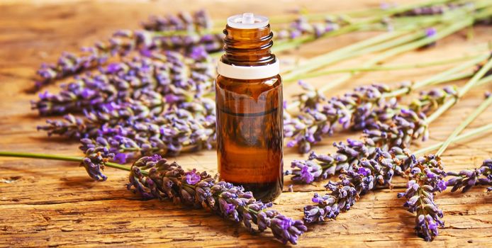 Lavender essential oil in a small bottle. Selective focus. nature.