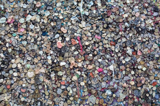 The texture of the landmark Berlin Wall is covered with chewing gum.