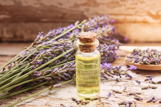 Lavender essential oil in a small bottle. Selective focus. nature.