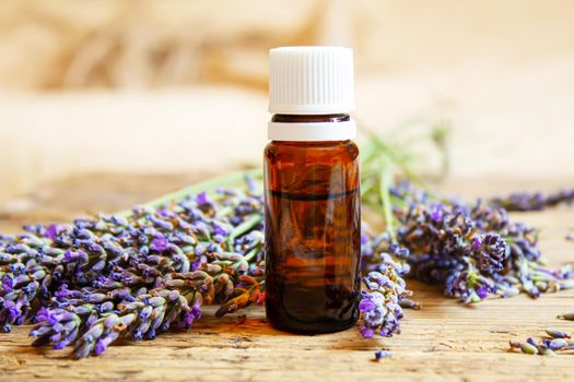 Lavender essential oil in a small bottle. Selective focus. nature.