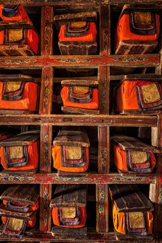 Folios of old manuscripts in library of Thiksey Gompa (Tibetan Buddhist Monastery). Ladakh, India