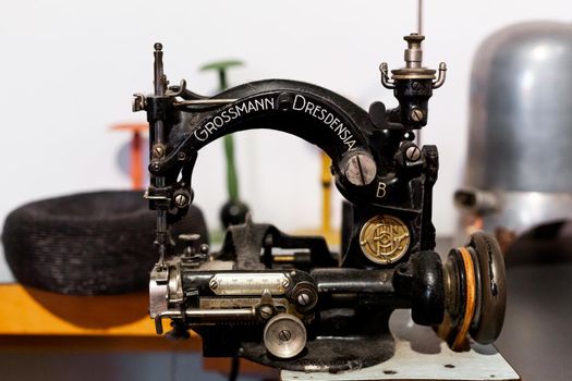 Museum of the history of the garment industry. Rare sewing machine. Berlin, Germany - 05.17.2019