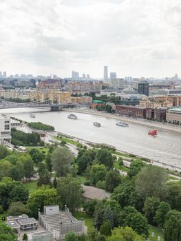 MOSCOW, RUSSIA - June 14, 2021. Panorama of Moscow - buildings on Prechistanskaya embankment, Muzeon Park of Arts and Krymsky bridge over Moscow-river.