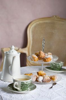 tea break in english style, vintage retro still life, homemade buns and a bouquet of white dalias. High quality photo