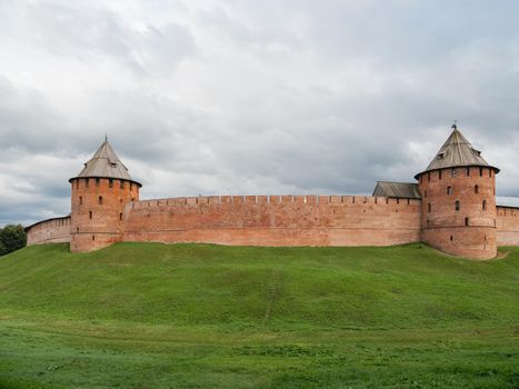 Walls and Fyodorovskaya and Mitropolichya towers of Novgorod Kremlin. Summer cloudy day in Veliky Novgorod, Russia.